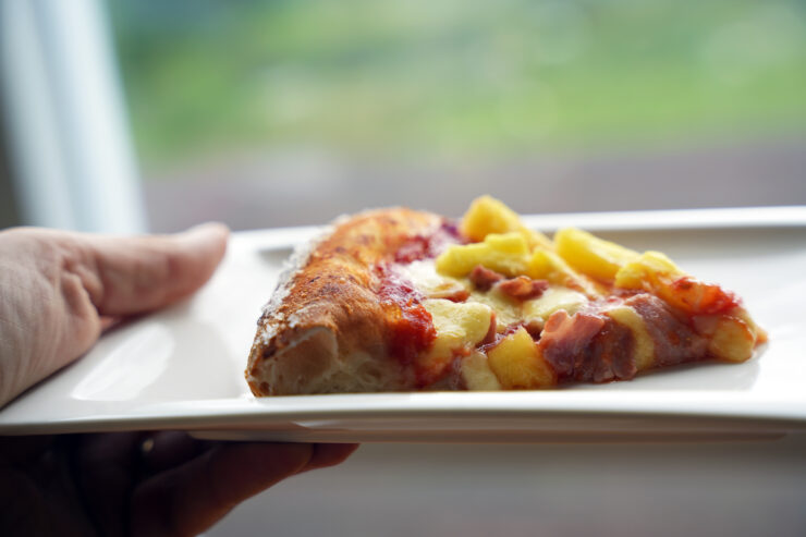 Hawaiian pizza slice