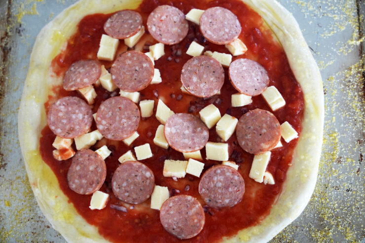 Uncooked pepperoni pizza